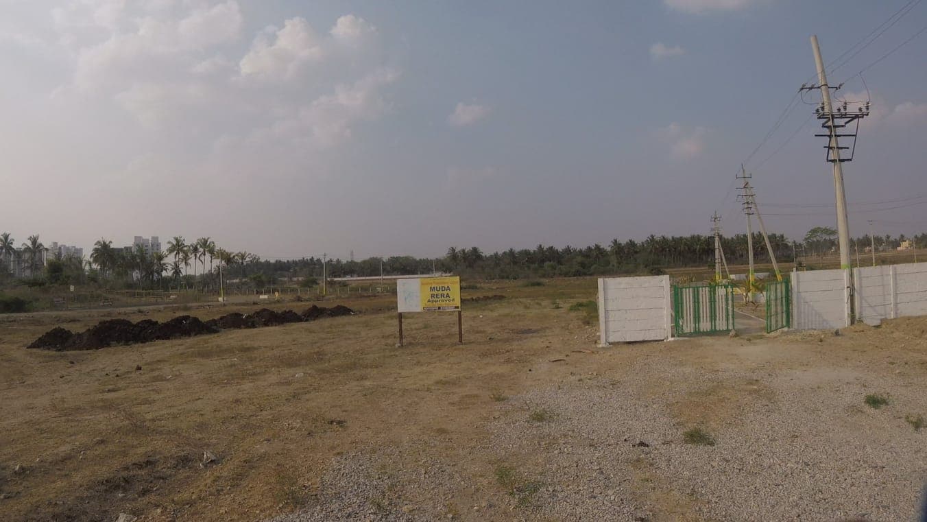 Brindhavan Layout entrance gate with the MUDA and RERA approved board