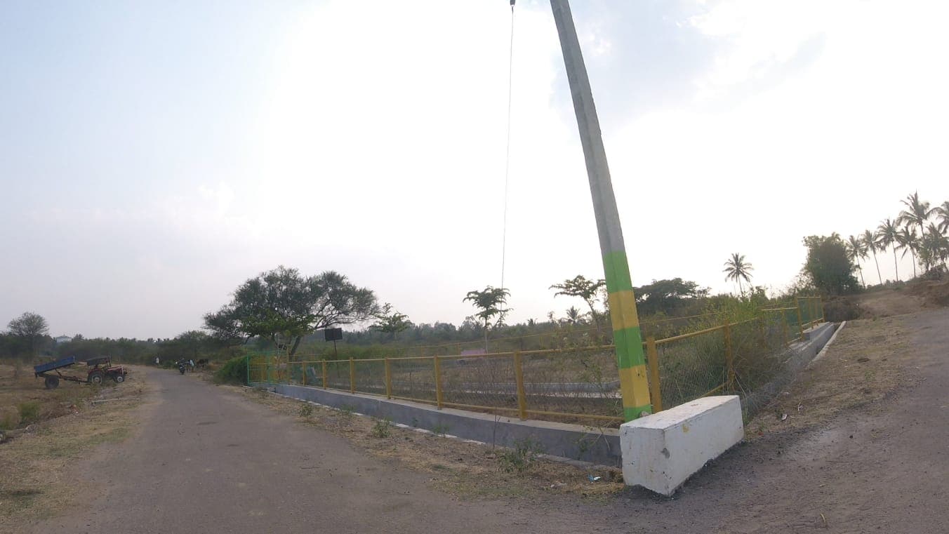 Fenced park enclosure and road along the layout